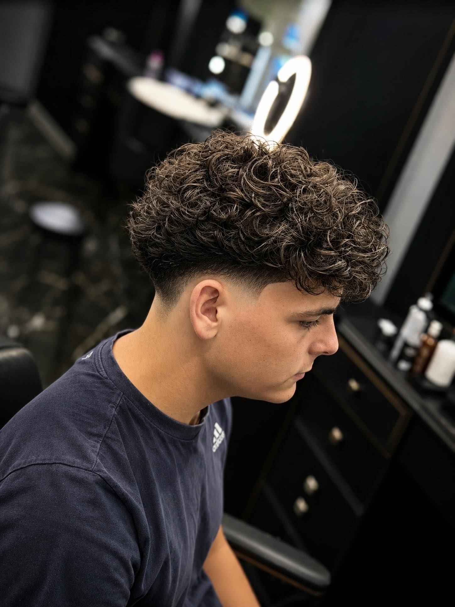 Sharp Fade With Textured Curls On Top