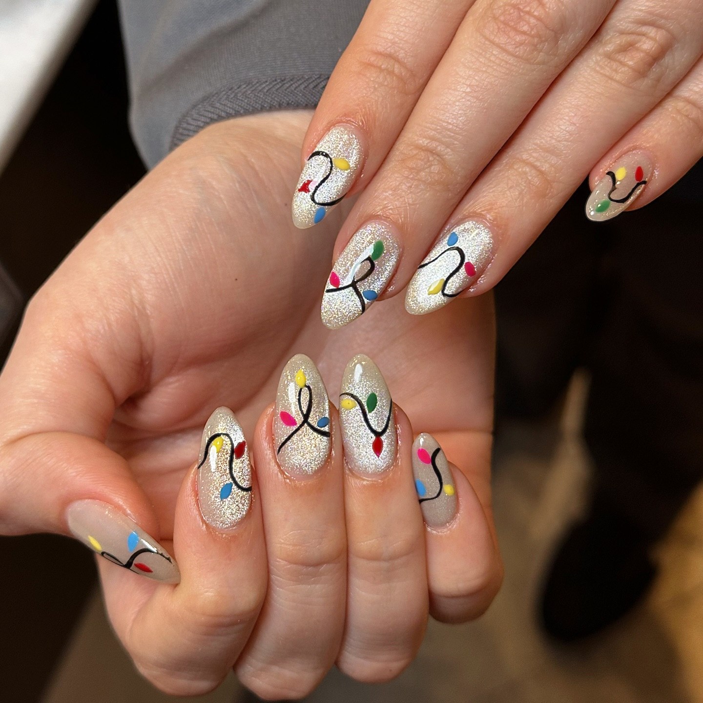 Festive Holiday Light Almond Gel Nails