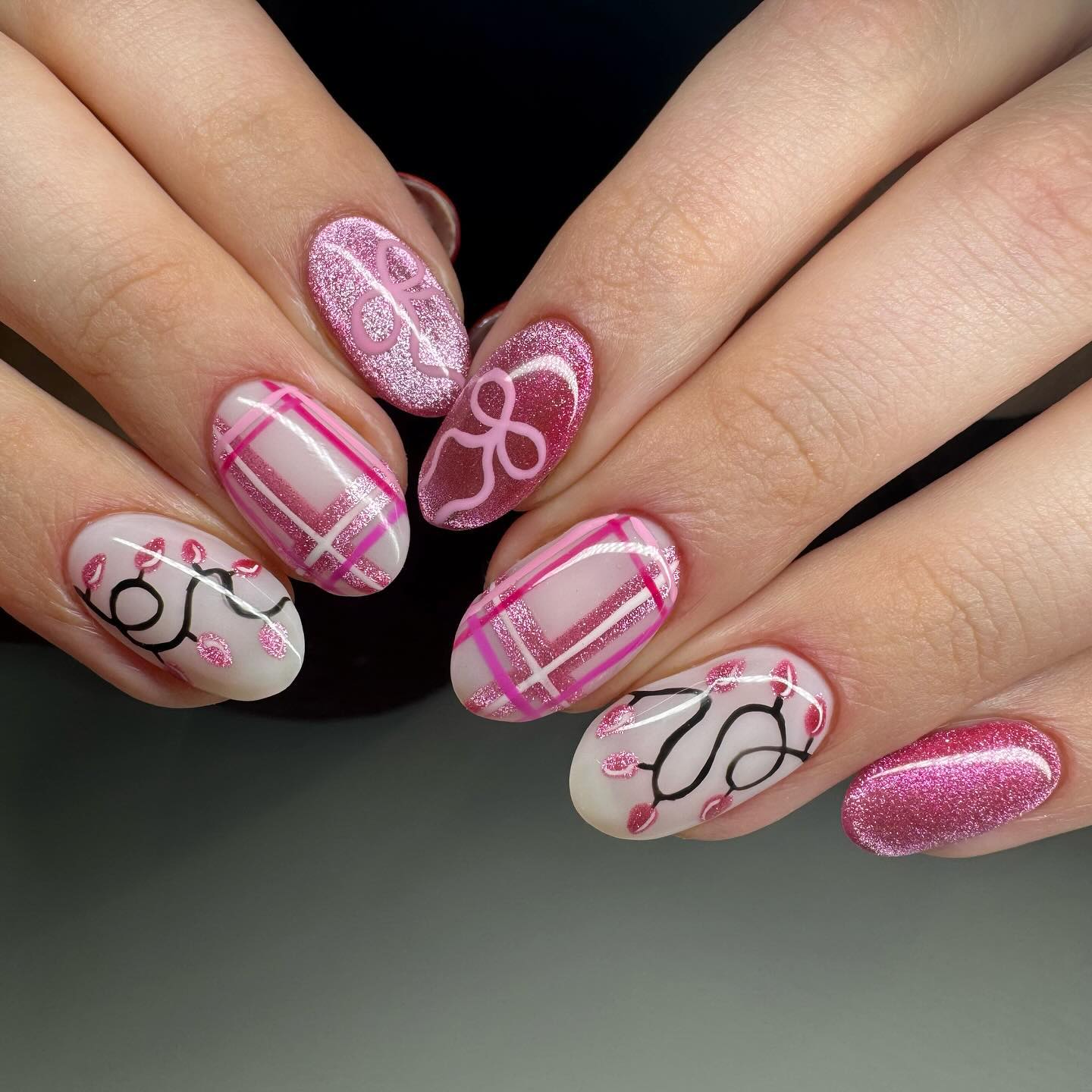 Festive Pink Cat Eye Christmas Lights Almond Nails