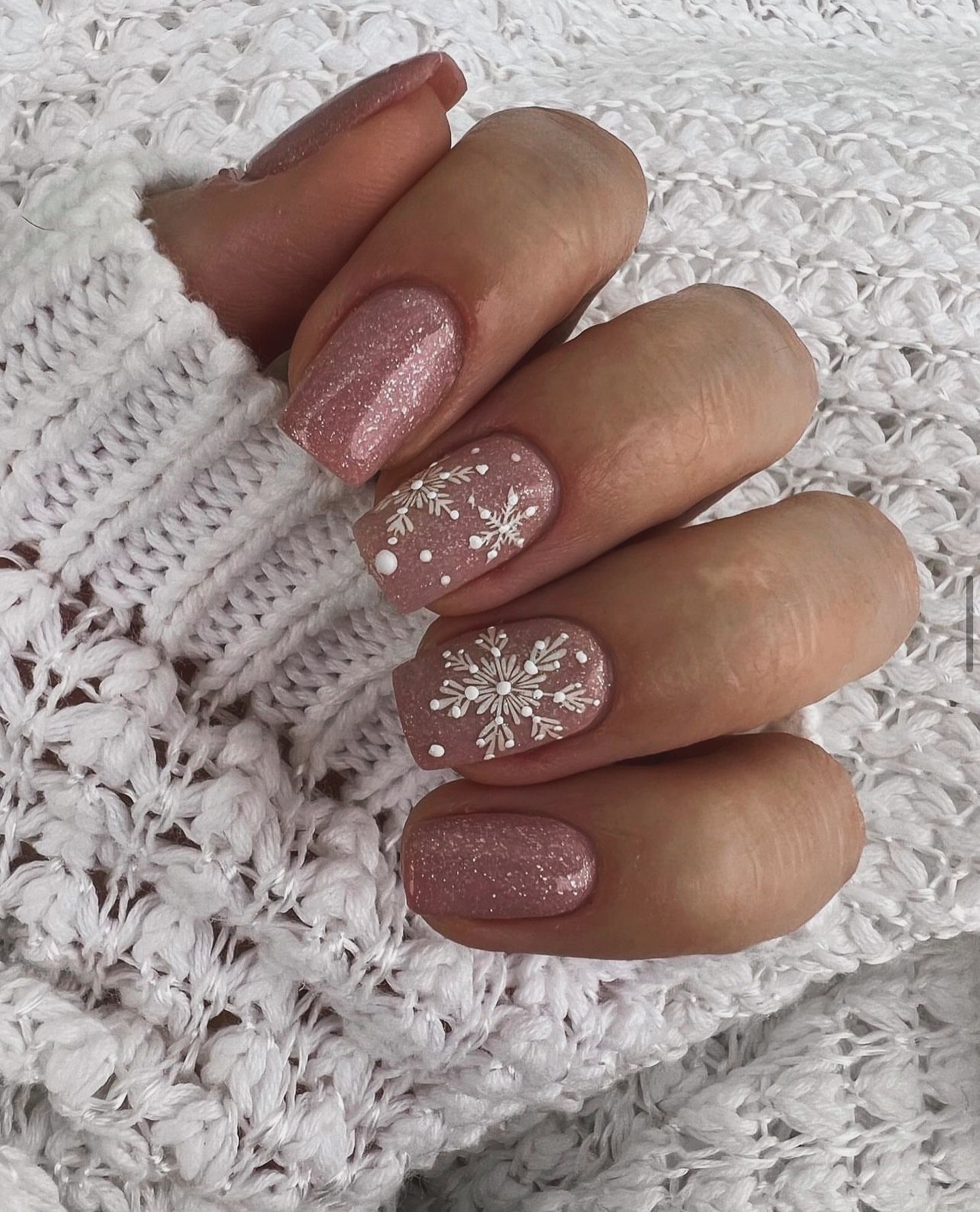 Shimmering Nude Pink Square Nails with White Snowflakes