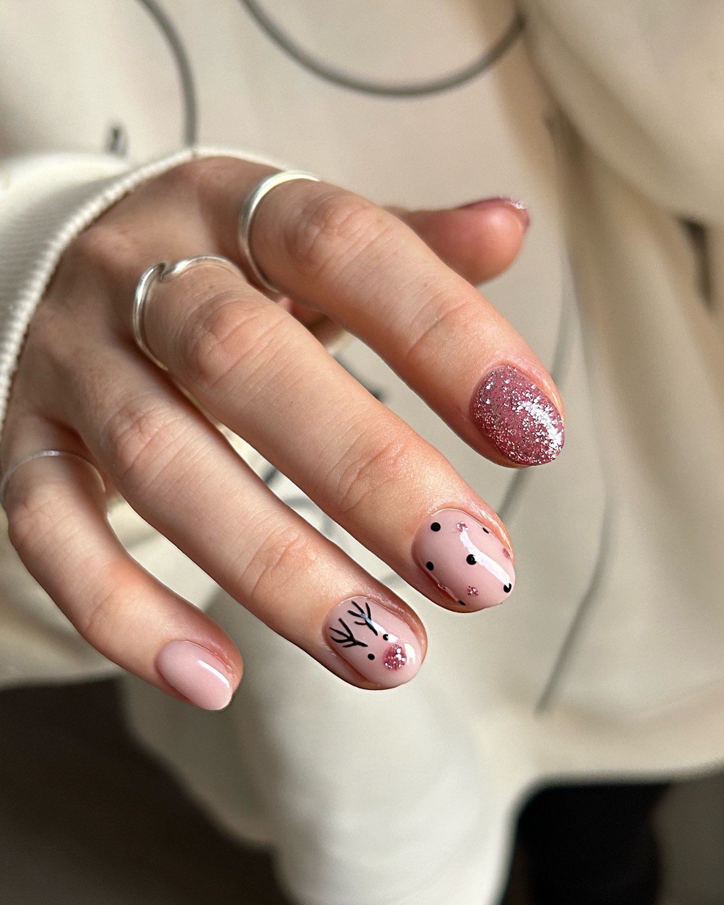 Glossy Pink Reindeer Nail Art With Glitter Accent