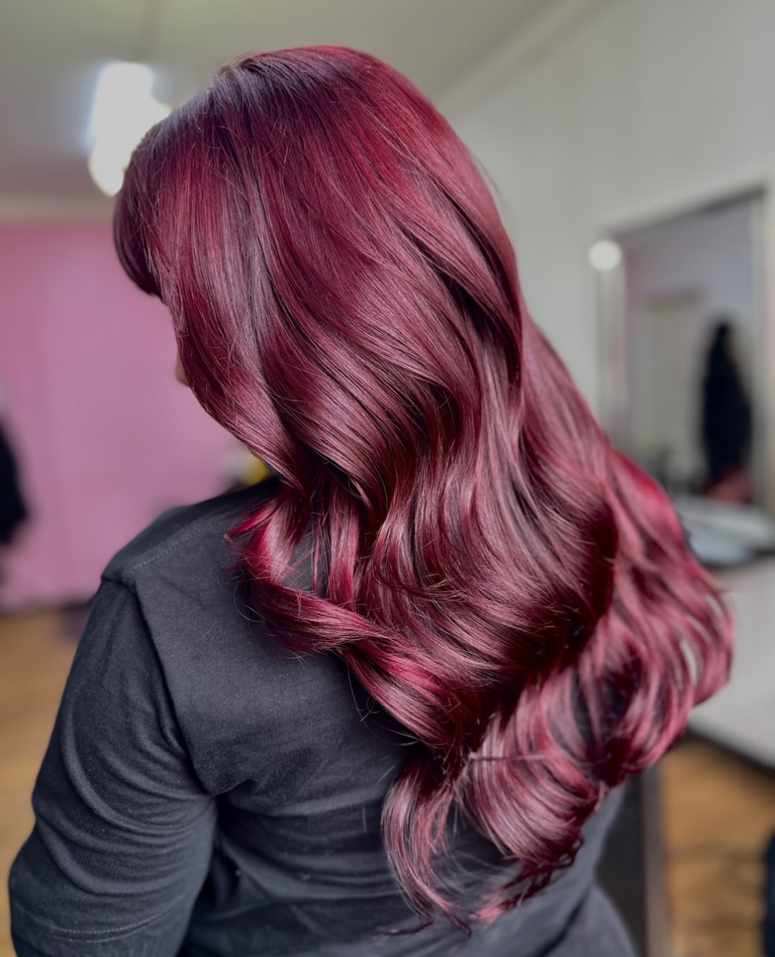 Rich Cherry Wine Waves With Face Framing Bangs