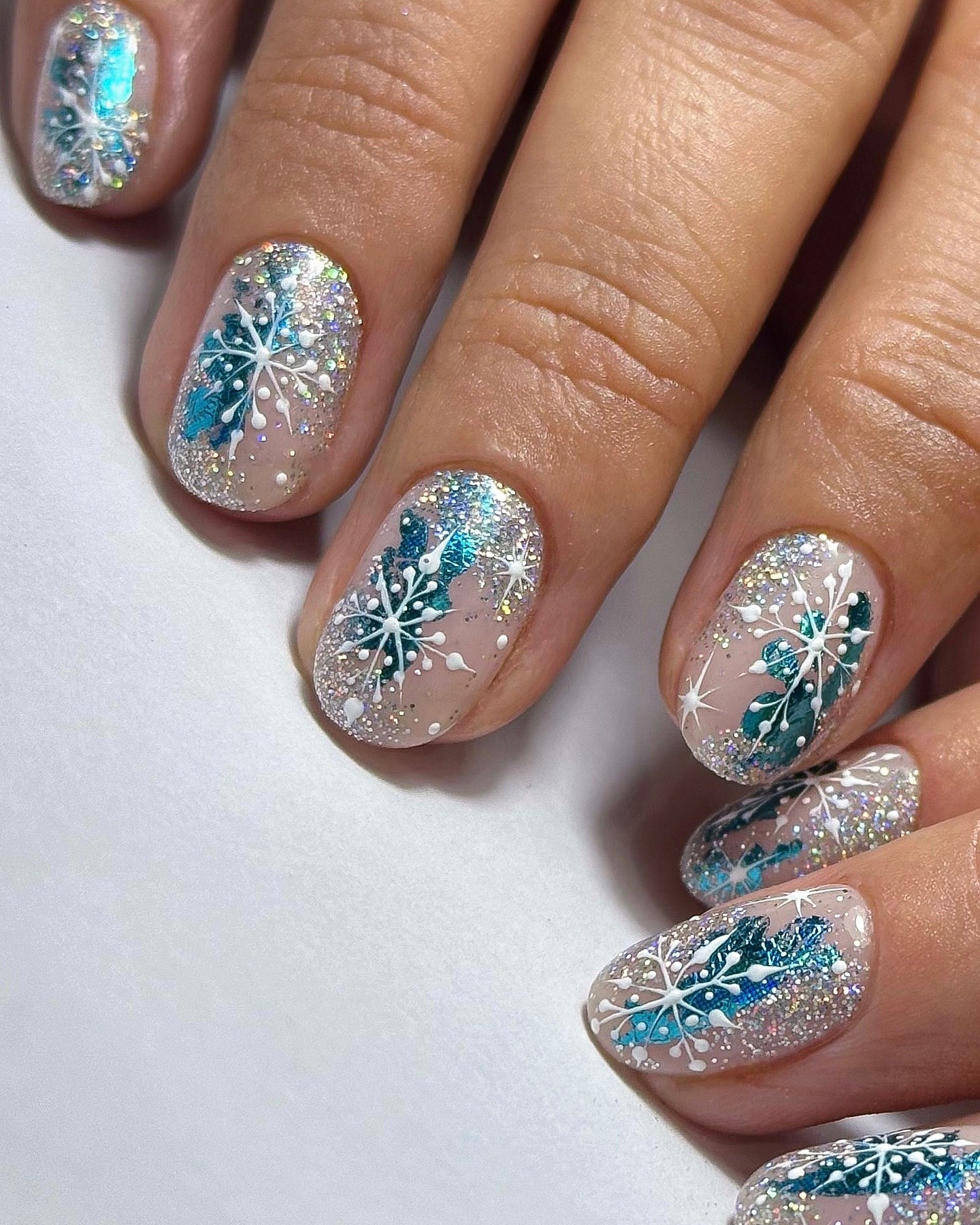 Sparkling Teal Snowflake Winter Oval Nails