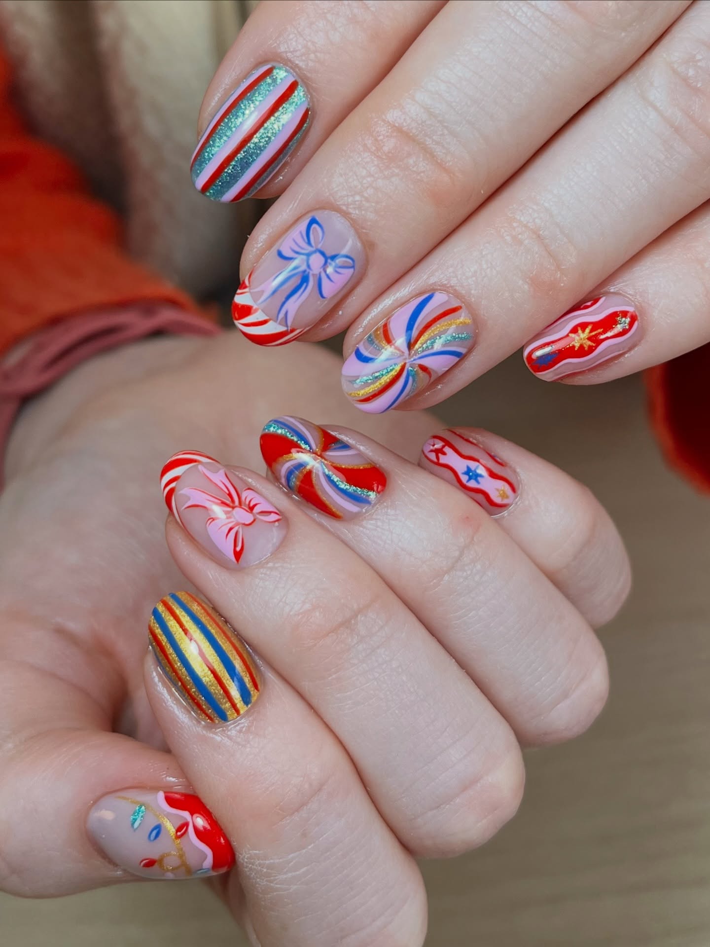 Festive Candy Cane and Bow Christmas Oval Nails