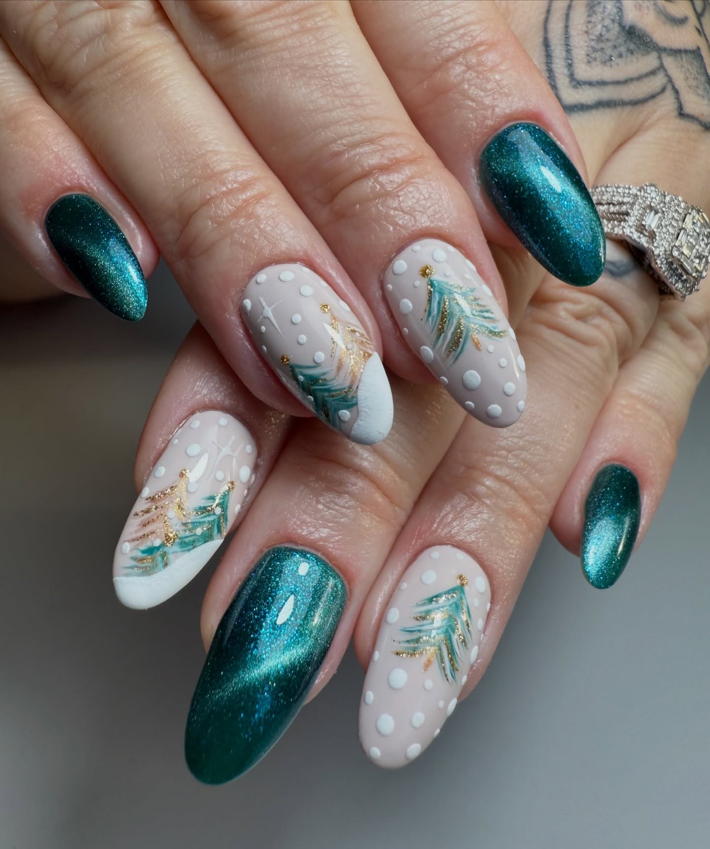 Emerald Cat Eye & Snowy Pine Tree Nail Art