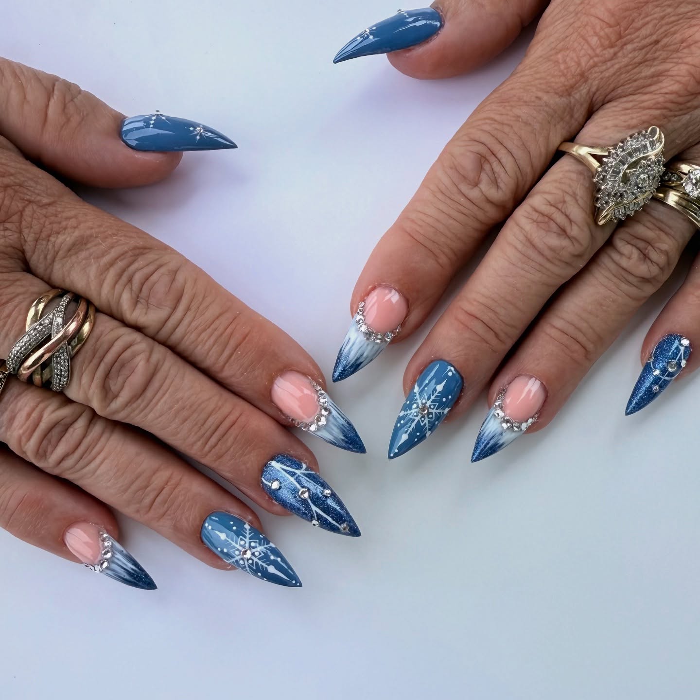 Denim Blue Snowflake Stiletto Nails with Rhinestone Accents