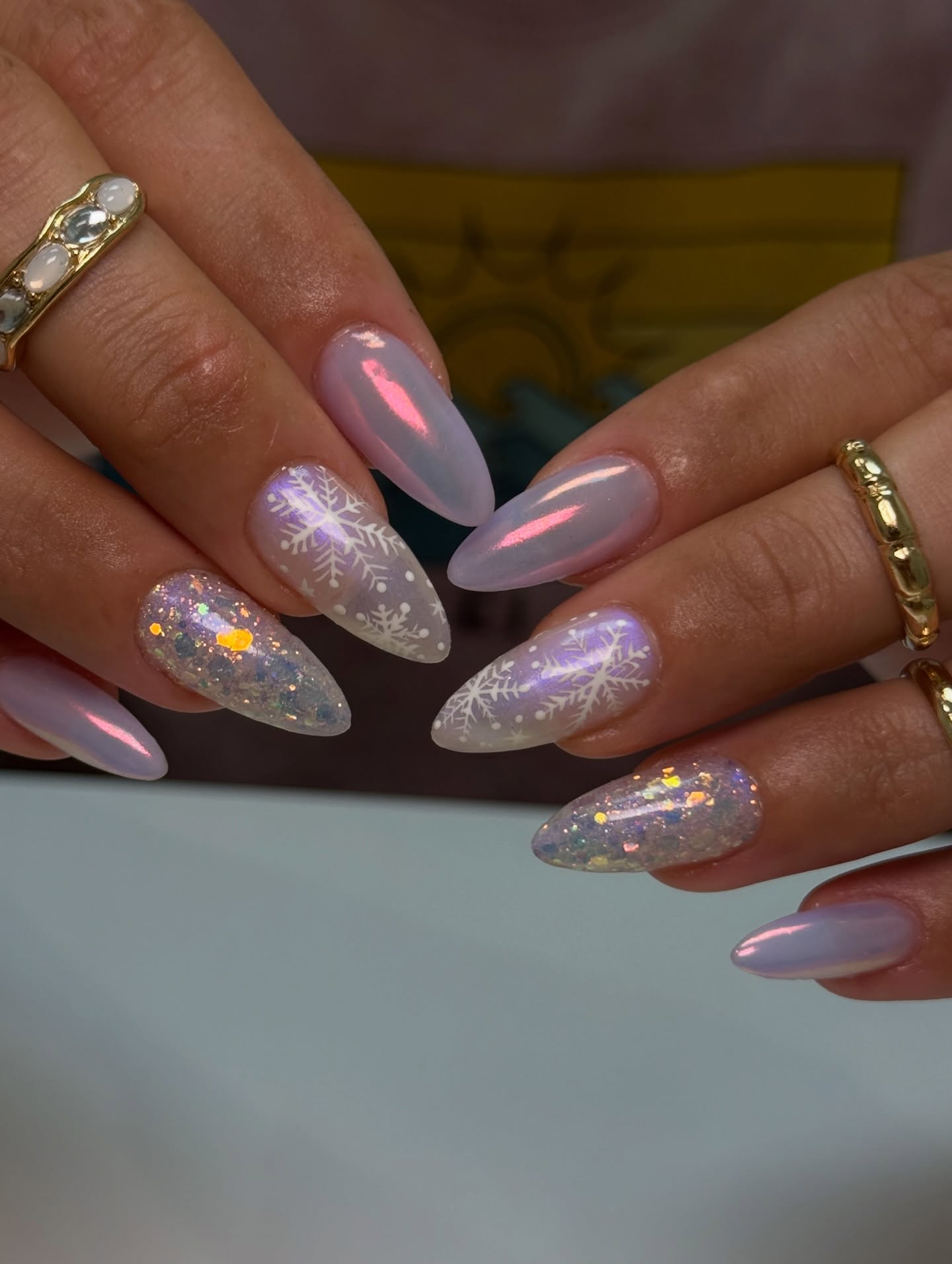 Iridescent Snowflake Stiletto Nails with Glitter Accents
