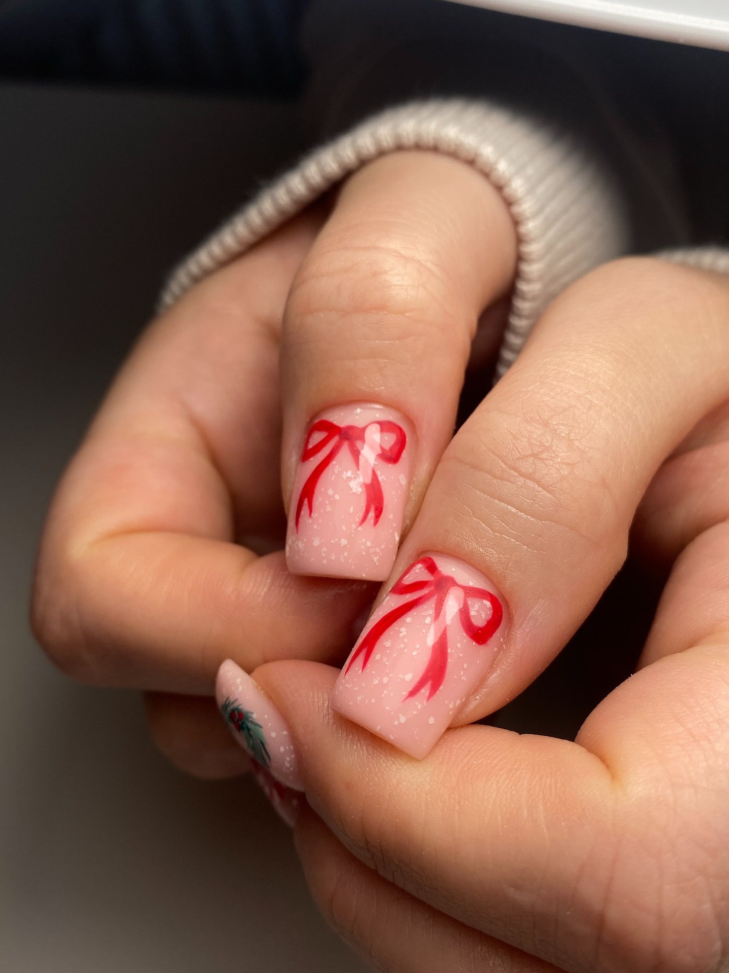 Festive Red Bows on Milky Pink Nails