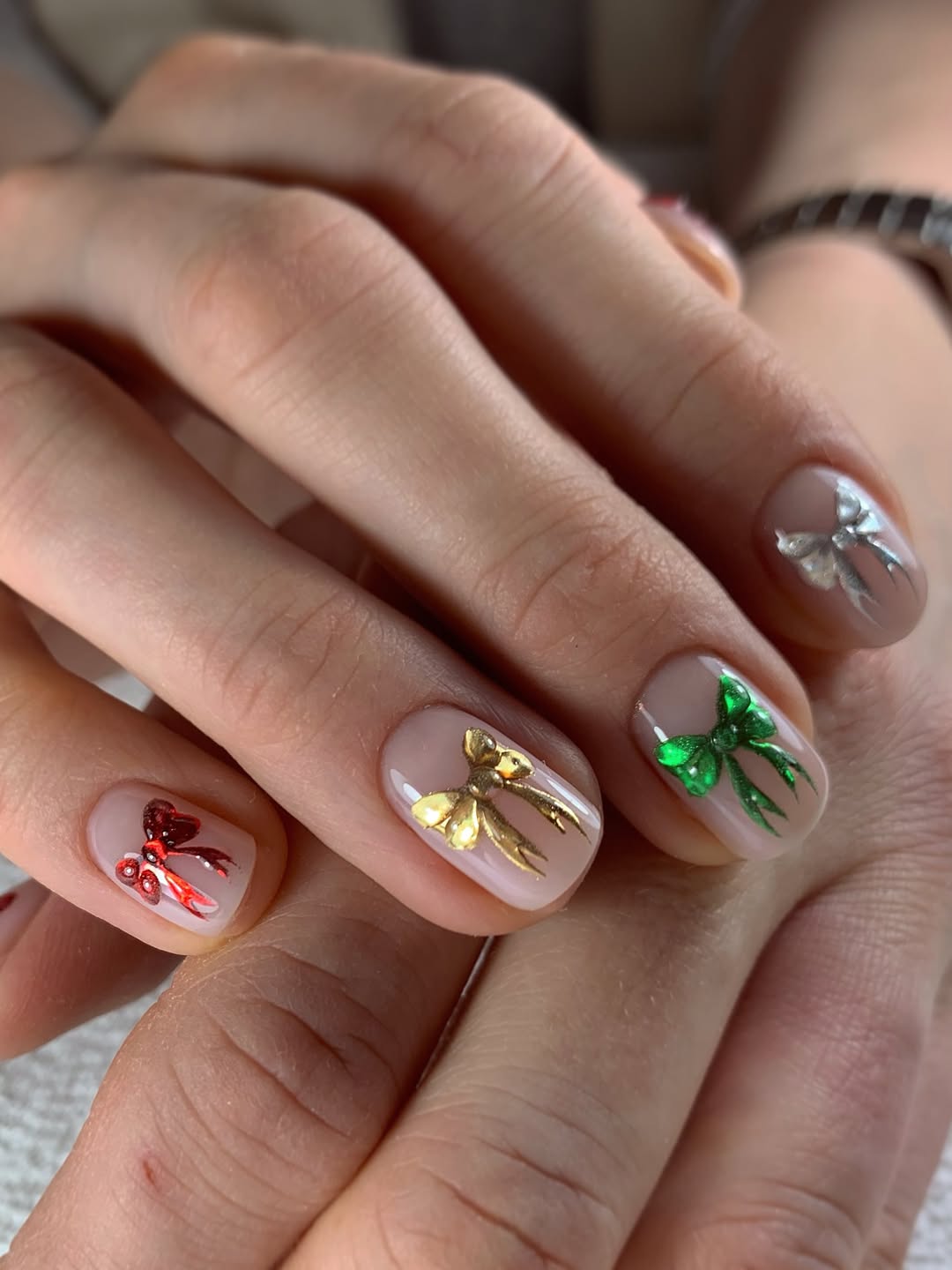 Festive Bow Accents on Sheer Nude Nails