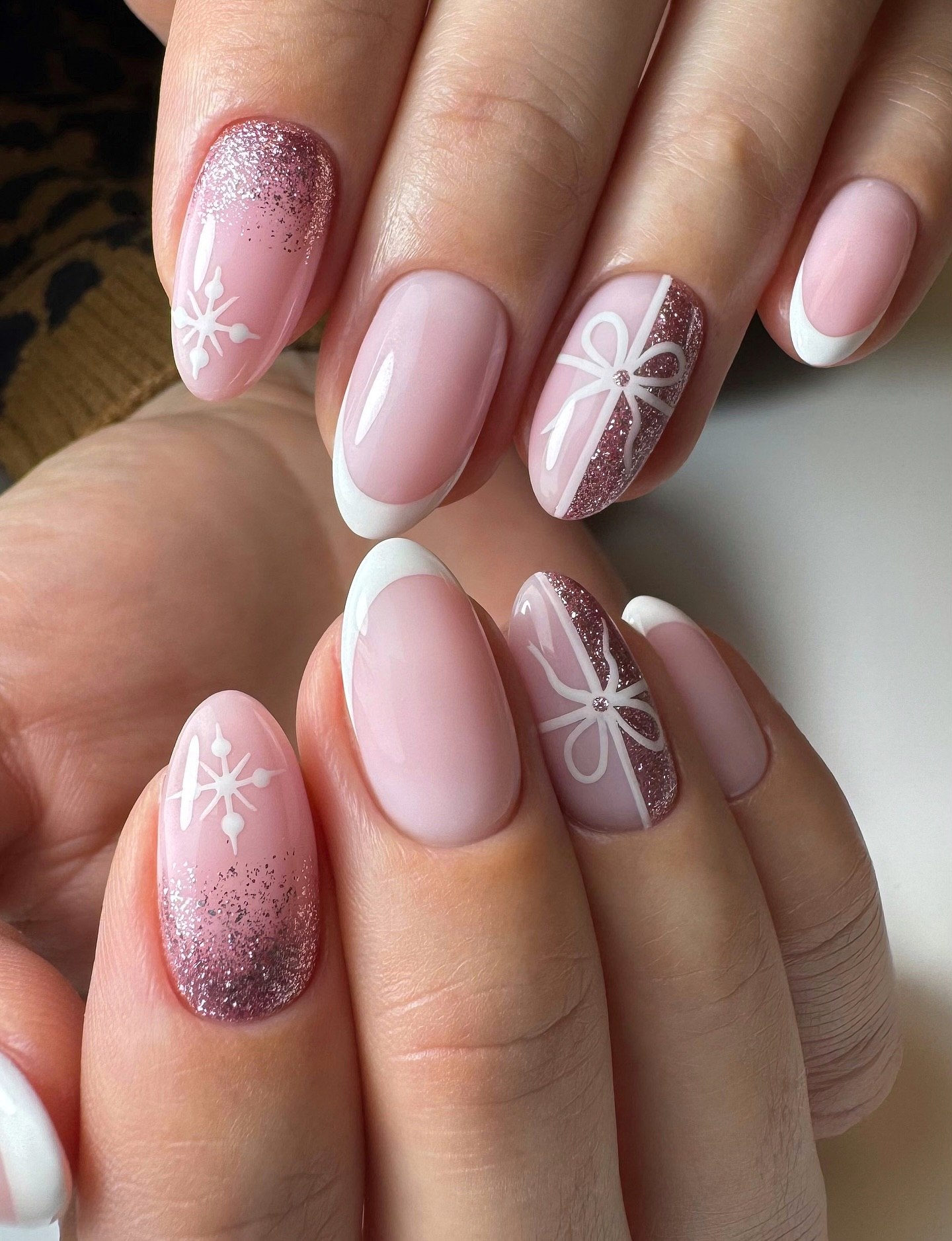 Pink French Tip Nails with Snowflake and Bow Art