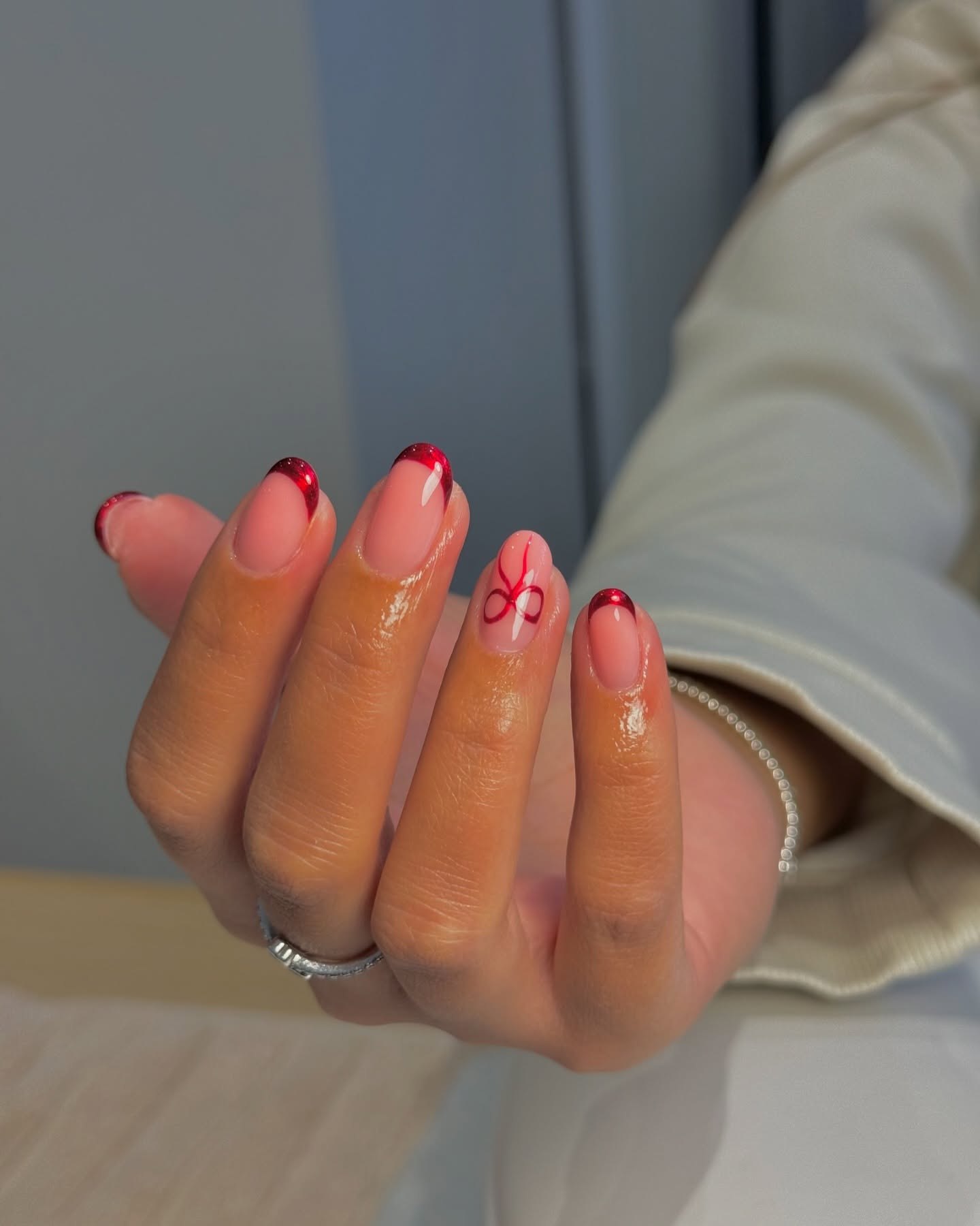 Glossy Red French Tip Almond Nails