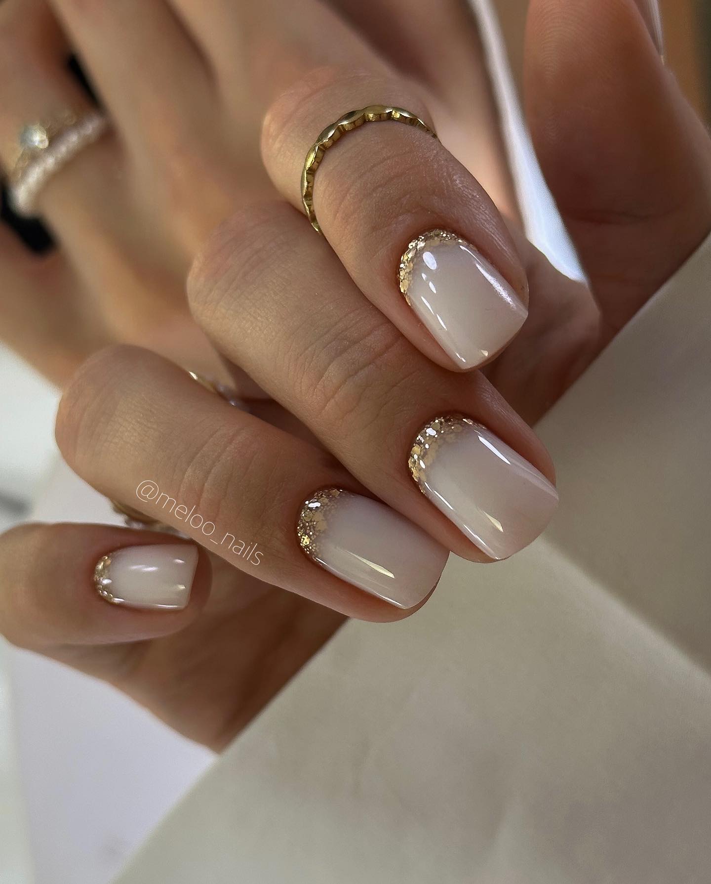 Milky White French with Gold Glitter Accent
