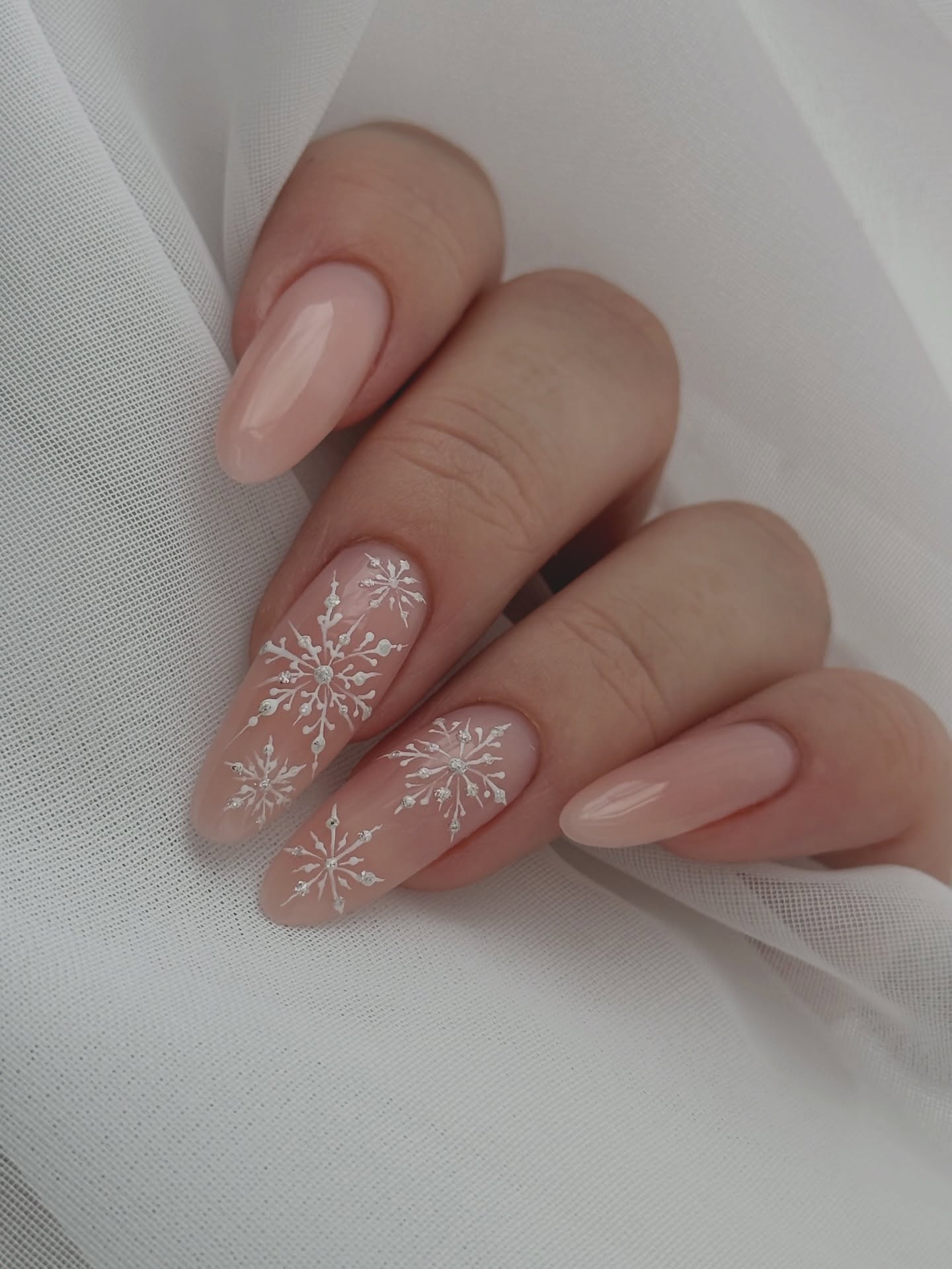 Winter Snowflake Almond Nails with Rhinestone Accents