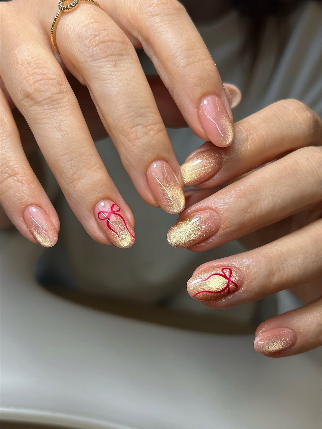 Golden Bow Accent Almond Cat Eye Nails