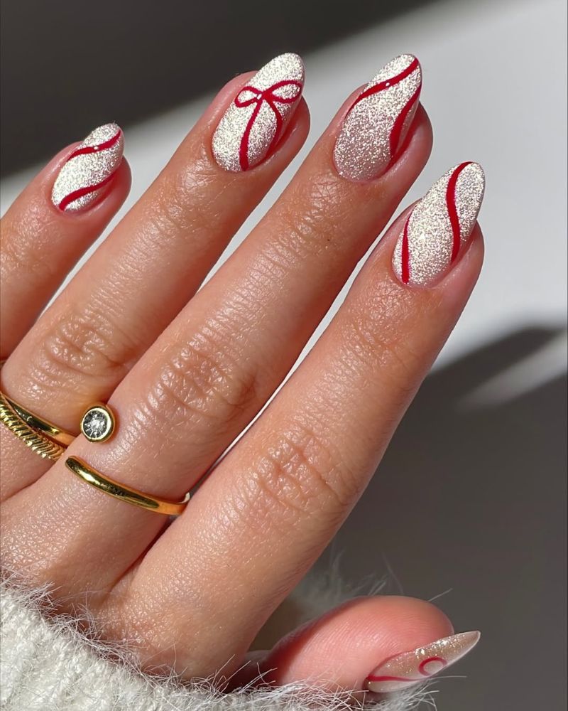 Medium Almond Silver Glitter Red Swirl Nails — Christmas Nail Designs