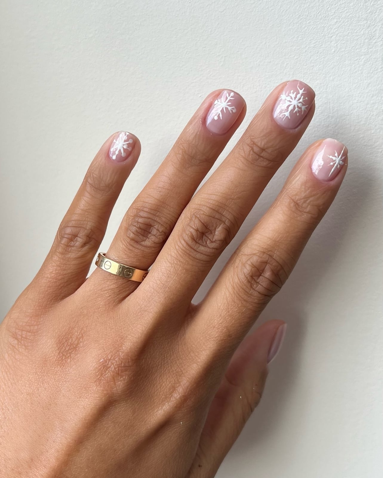 Short Almond Sheer Nude Snowflake Nails — Christmas Nail Designs