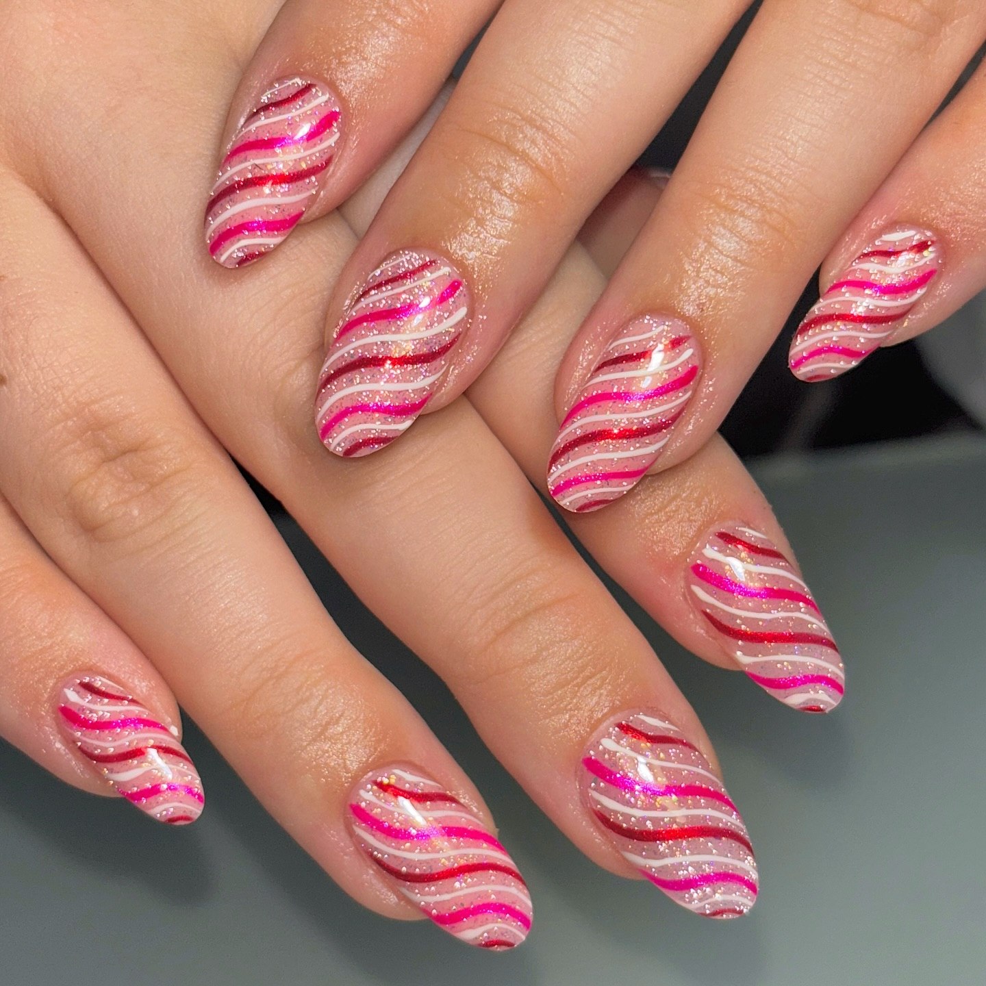 Pink Candy Cane Swirl Almond Nails