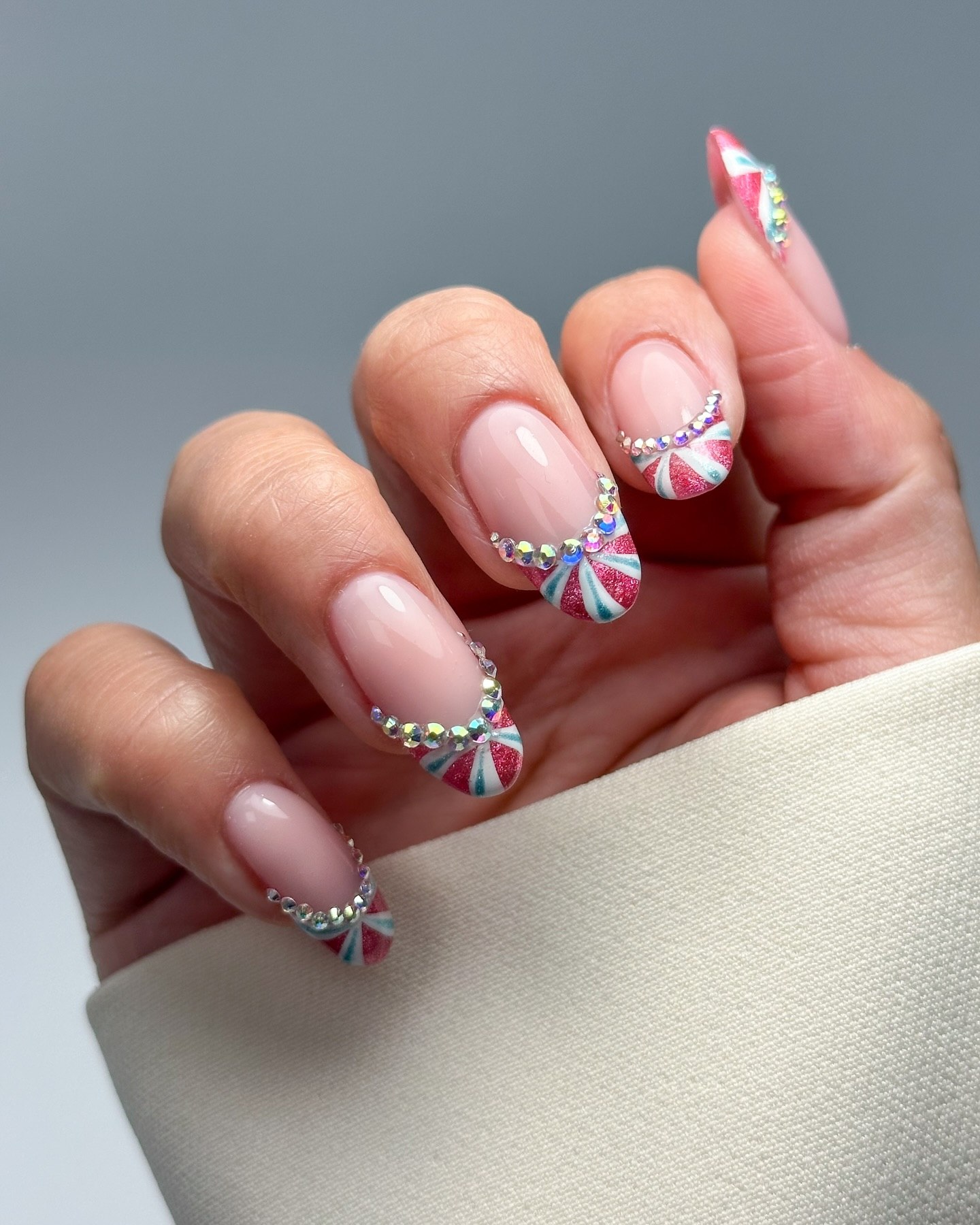 Sparkling Candy Cane French Tips with Rhinestone Accents