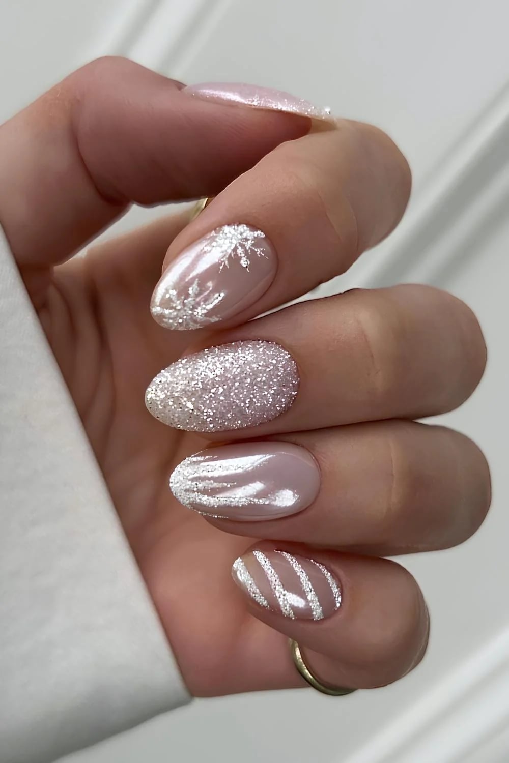 Pale Pink Oval Nails With Glitter and Silver Accents — Winter White Nails