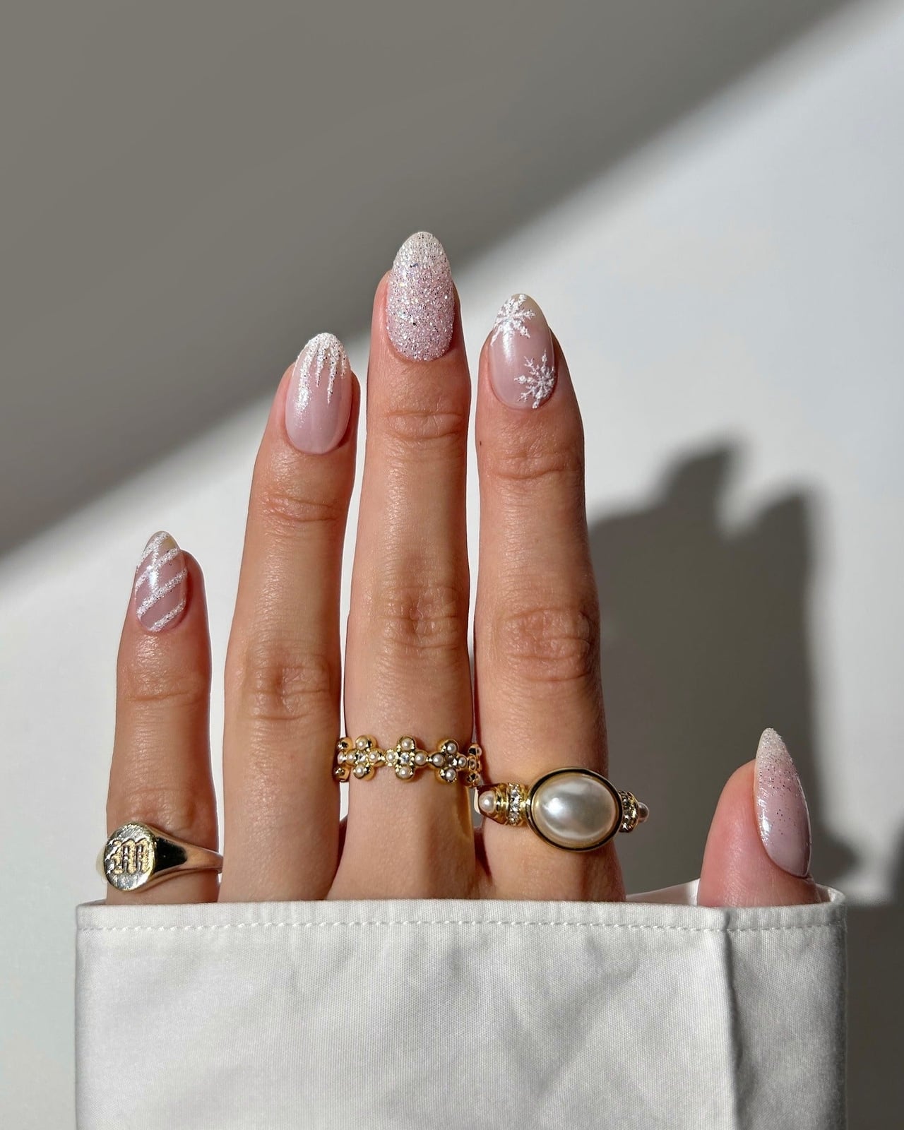 Short Almond Nails With Glitter French Tips and Snowflakes — Winter White Nails