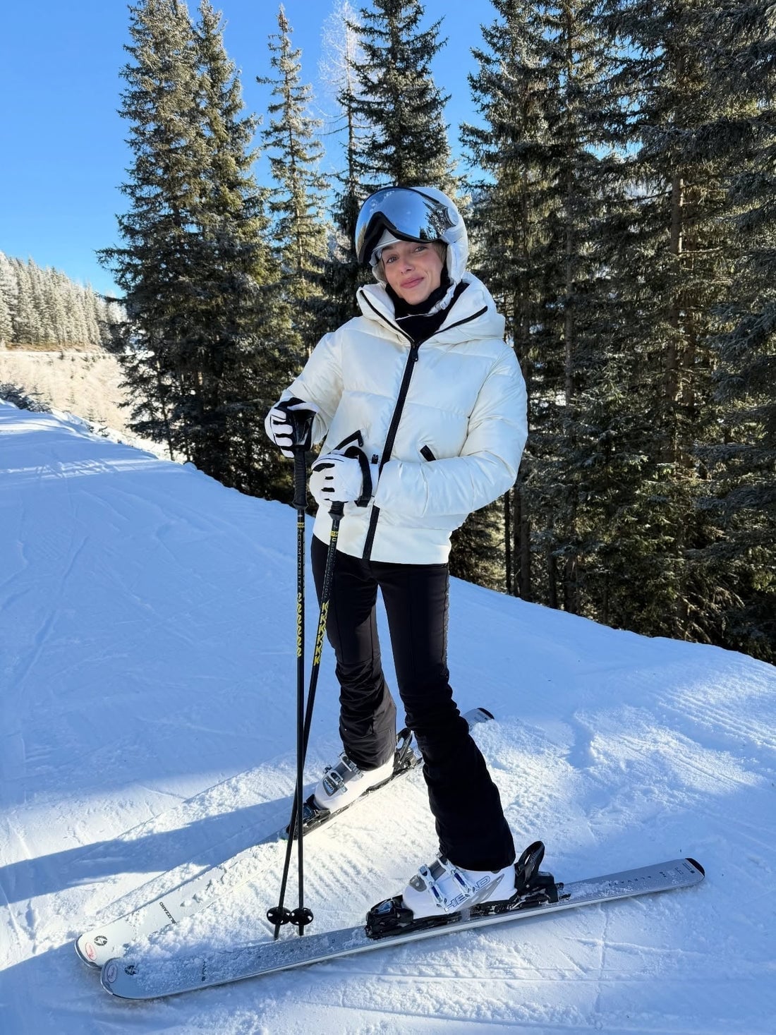 Classic White Puffer Ski Jacket and Black Pants — Ski Outfits for Women
