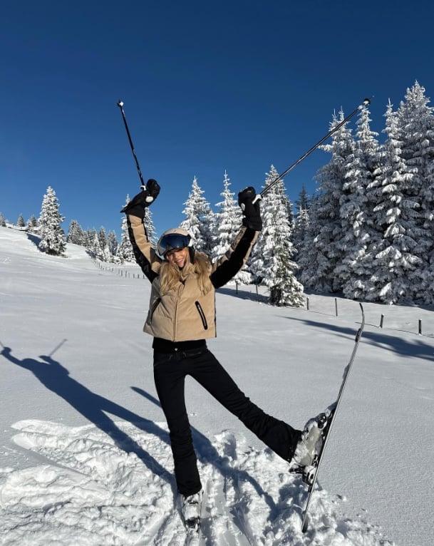 Tan Puffer Vest Over Black Ski Attire — Ski Outfits for Women