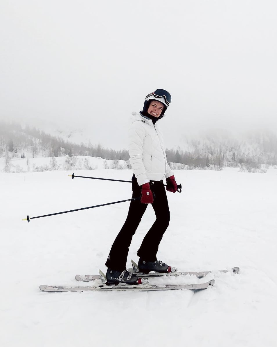 White Puffer Jacket with Flared Black Ski Pants, Close-Up Take — Ski Outfits for Women