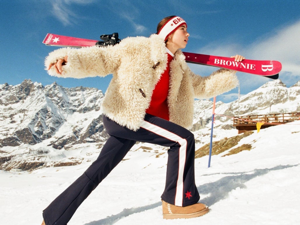 Cream Textured Jacket Over Red Sweater and Navy Pants — Ski Outfits for Women