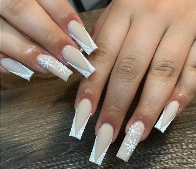 Long Coffin Nude With Glossy White Snowflakes — Winter Acrylic Nails