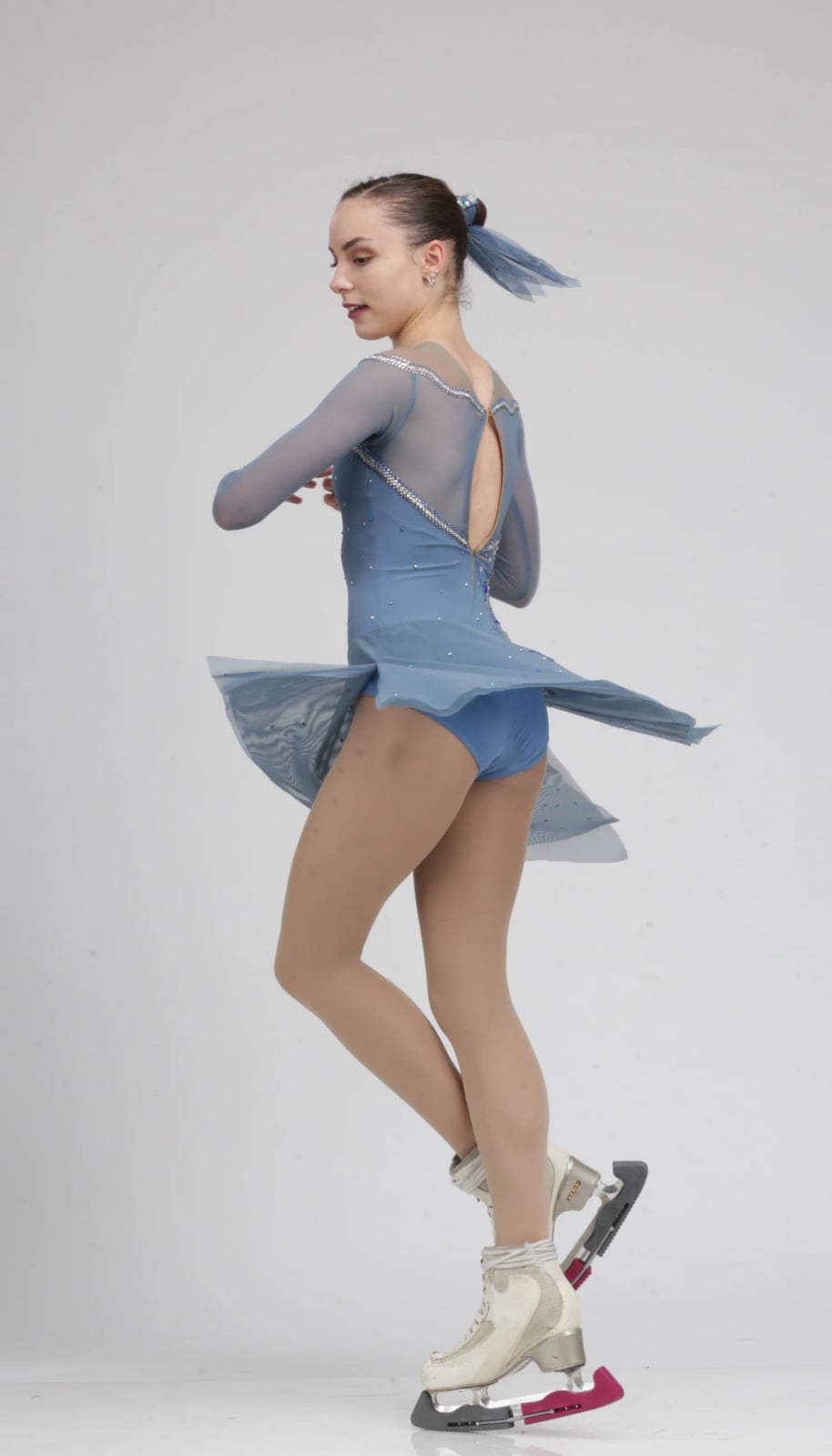 Pale blue figure skating dress with sheer sleeves, Close-Up Take — Ice Skating Outfit