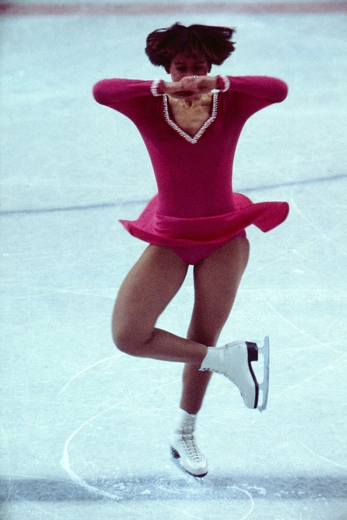 Pink ice skating dress with flared skirt in motion — Ice Skating Outfit