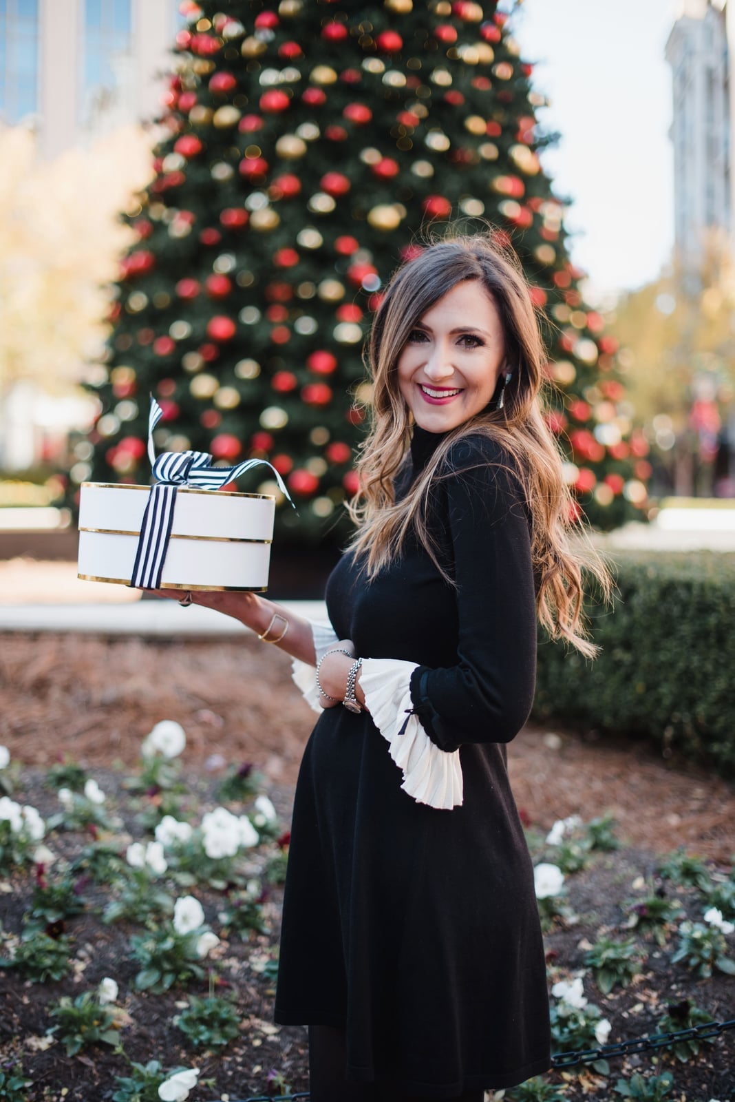 Black fit-and-flare dress with pleated cuffs — Christmas Eve Outfits