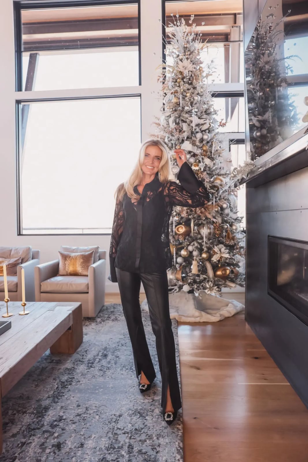 Black lace blouse with flared trousers and embellished heels — Christmas Eve Outfits
