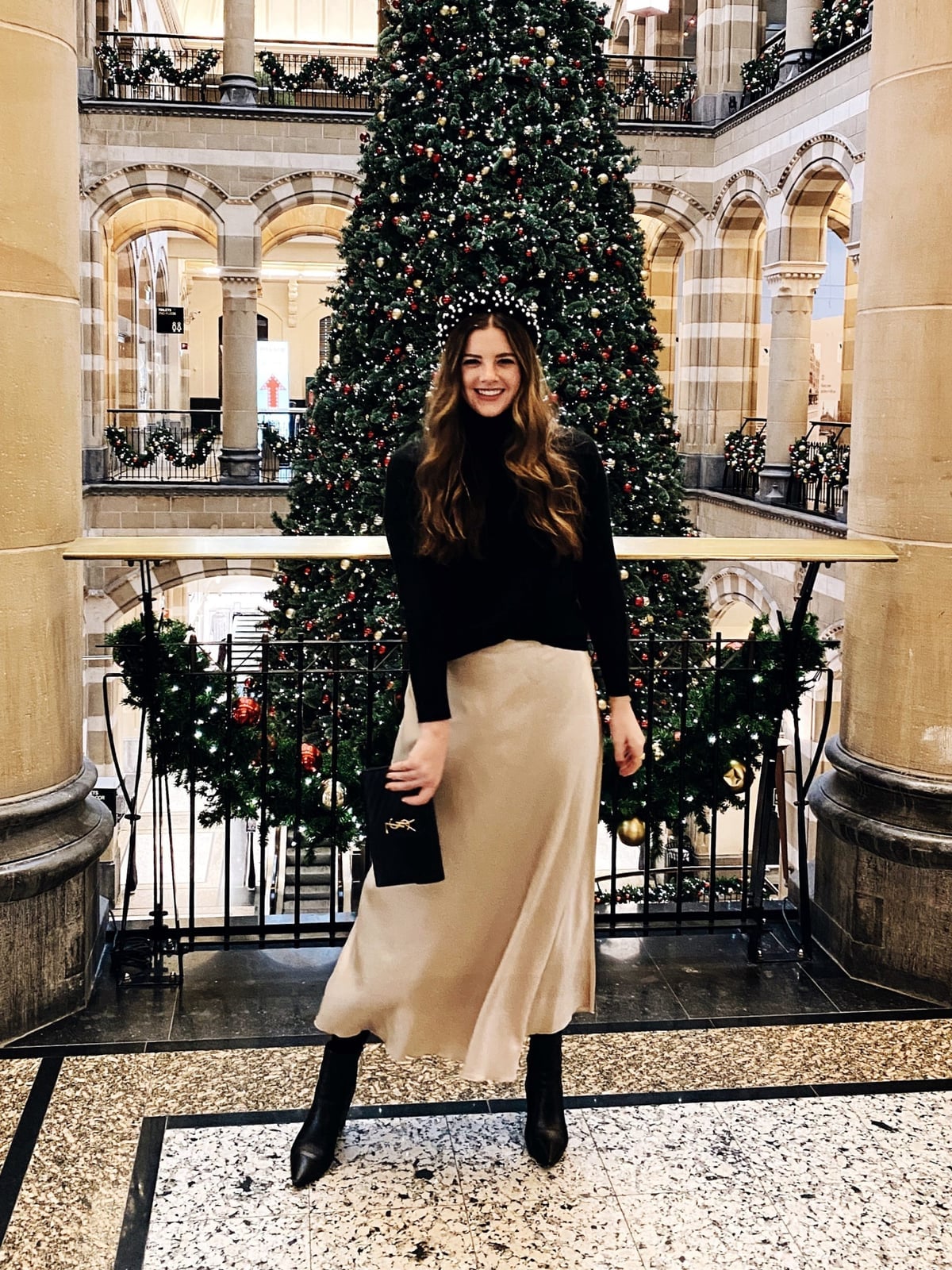 Black turtleneck with champagne satin midi skirt — Christmas Eve Outfits