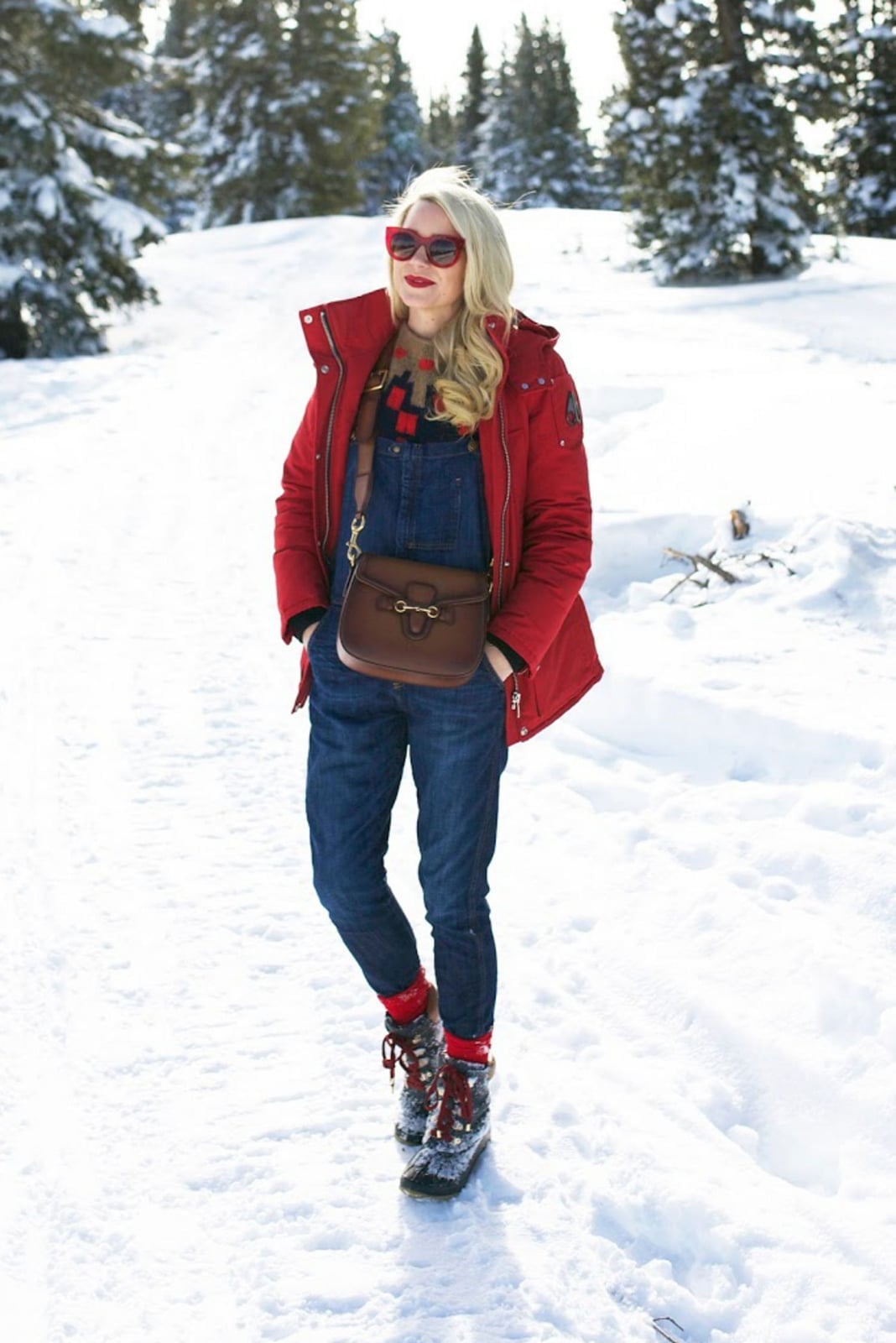 Red puffer jacket over denim overalls Red puffer jacket over denim overalls — Cozy Winter Outfits