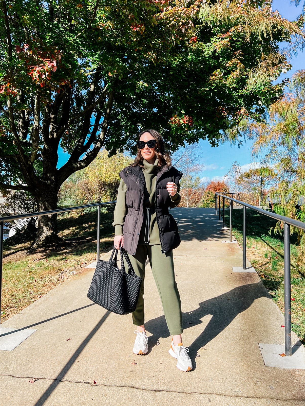 Black puffer vest over olive green hoodie and sweatpants Black puffer vest over olive green hoodie and sweatpants — Cozy Winter Outfits