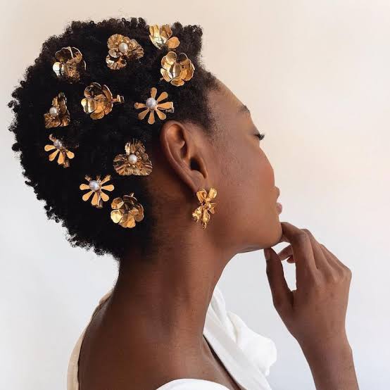Short Textured Afro With Gold Flower Pins Short Textured Afro With Gold Flower Pins — Holiday Hairstyles