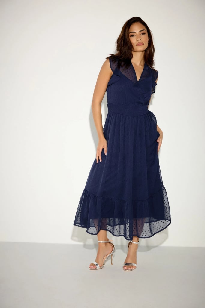 Navy Blue Midi Wrap Dress with Polka Dot Overlay and Ruffles — Bridesmaid Dress Ideas