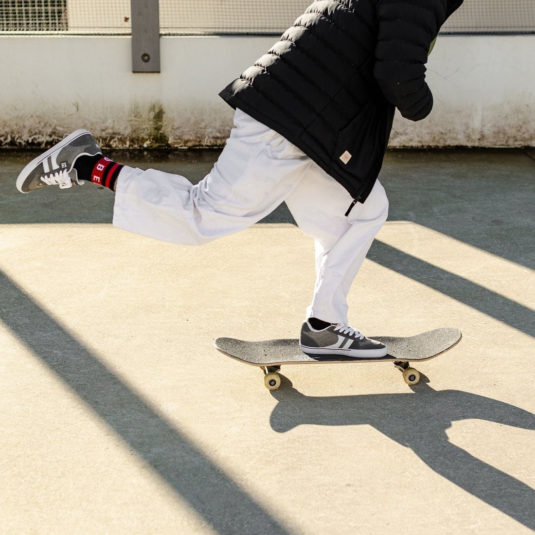 Puffer Jacket Over White Top with Baggy White Pants — Skater Outfits