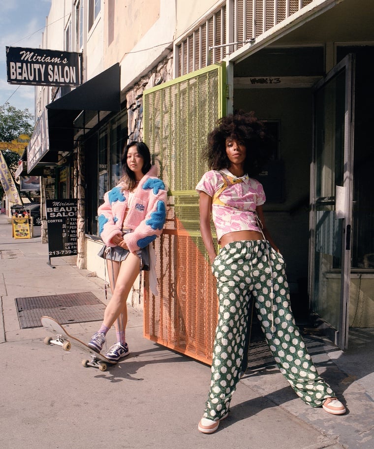 Pink Teddy Jacket Over Graphic Tee with a Gray Skirt — Skater Outfits
