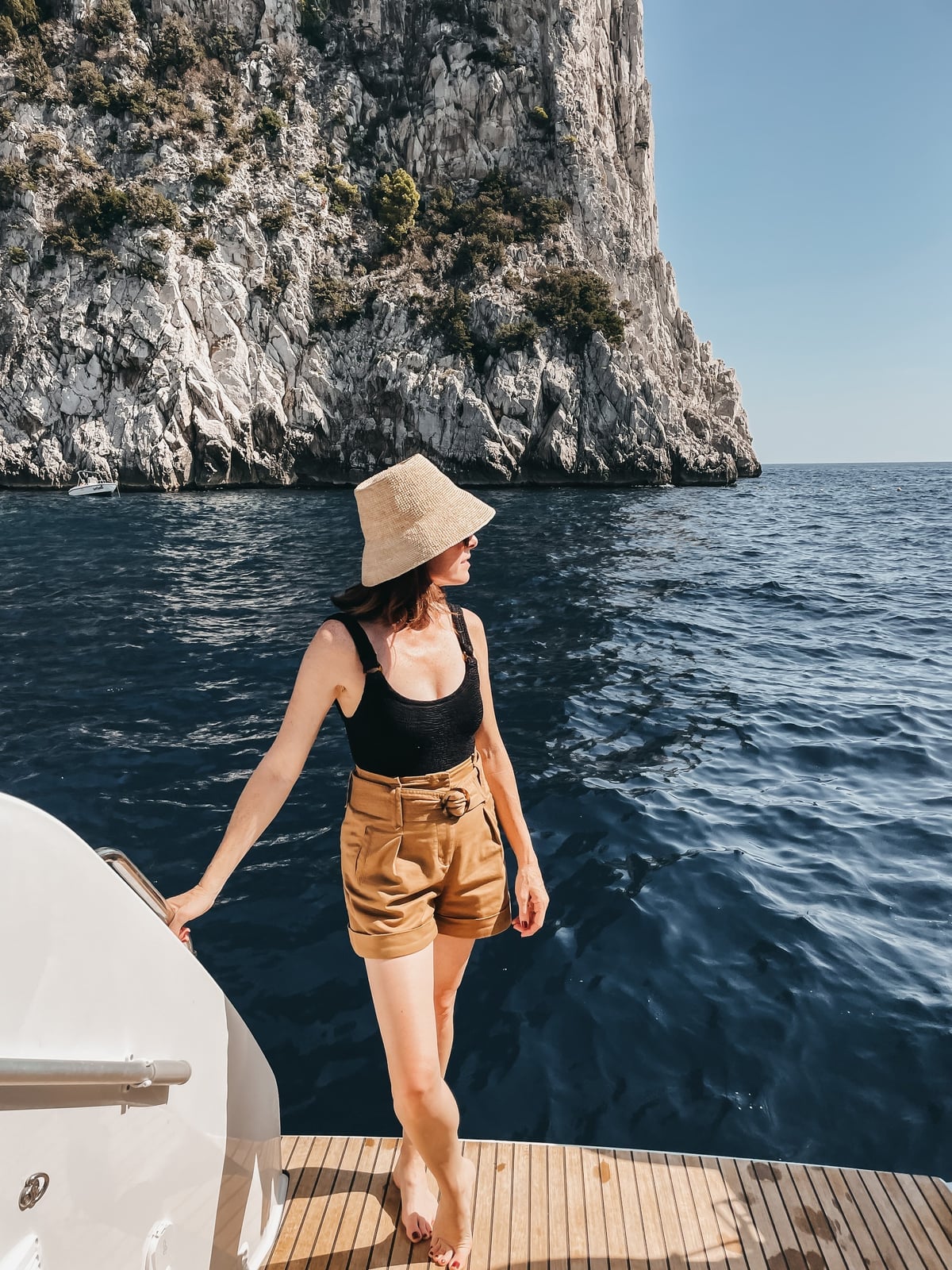 Black Tank Top and Tan Shorts for Boating Excursion — Italy Outfits