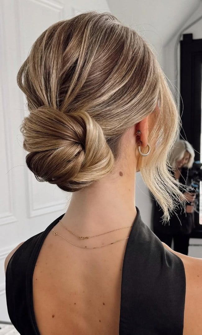 Sculpted Blonde Low Bun With Face-Framing Pieces — Low Bun Wedding Hair