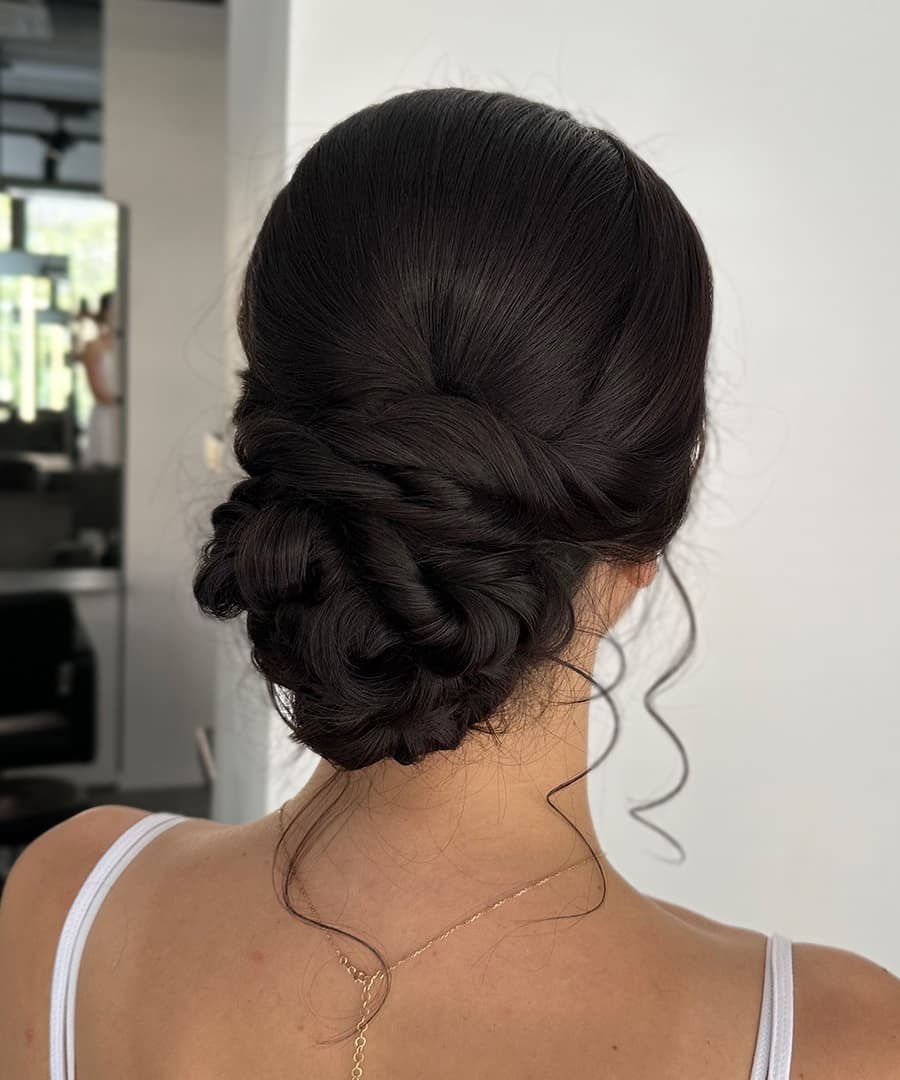 Dark Brown Low Bun With Curtain Bangs — Low Bun Wedding Hair