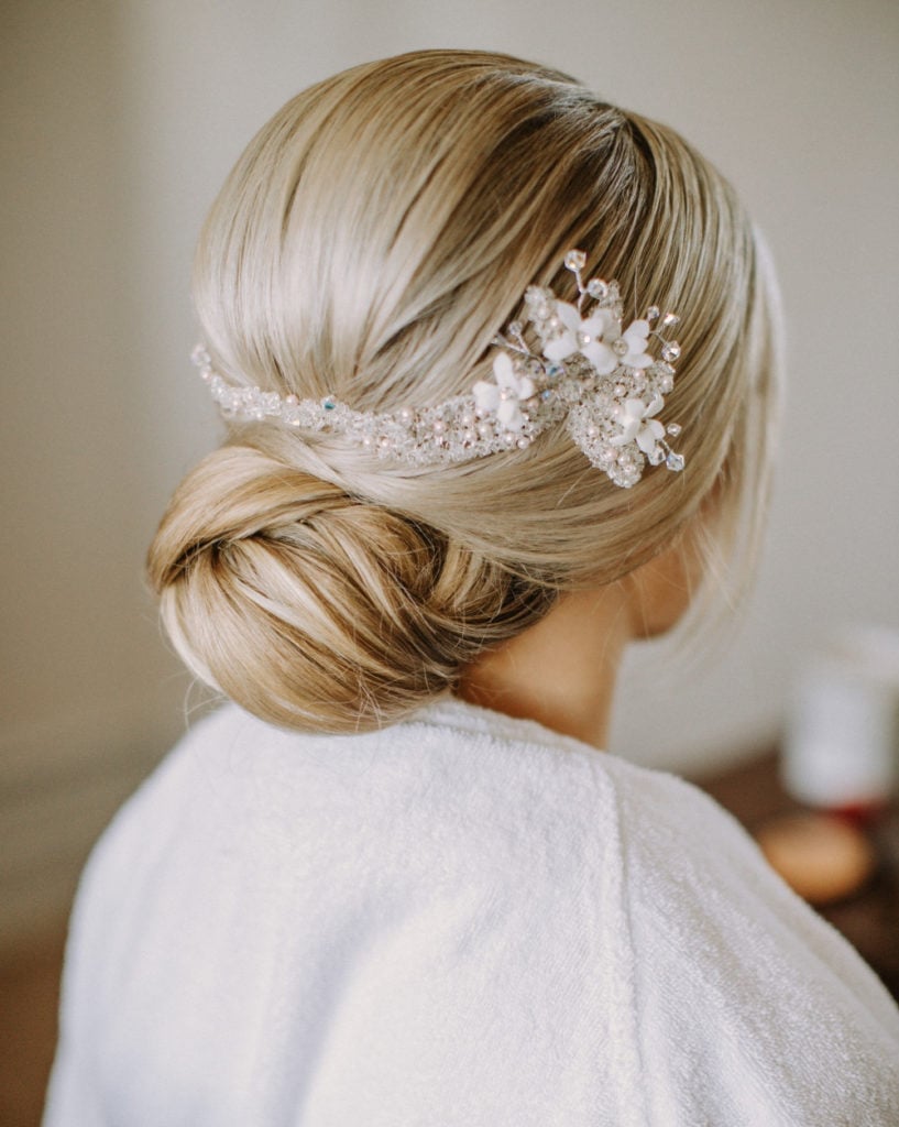 Sleek Ash Blonde Low Bun With Accessory — Low Bun Wedding Hair