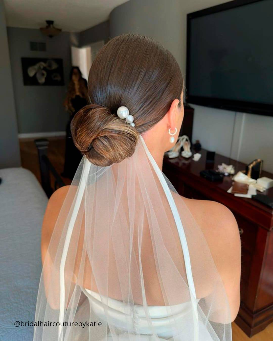 Dark Brown Low Bun With Veil and Pearl Accessory — Low Bun Wedding Hair