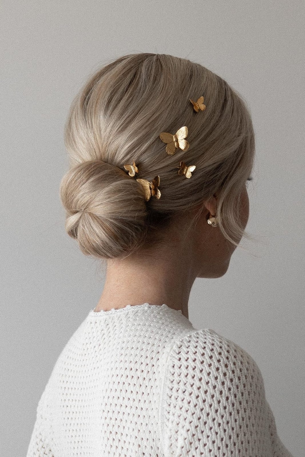 Ash Blonde Low Bun With Soft Curtain Bangs — Low Bun Wedding Hair