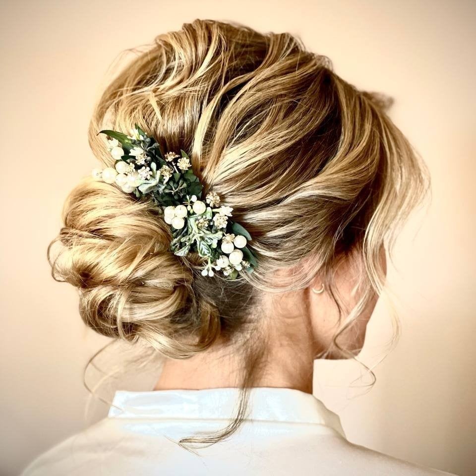 Messy Blonde Low Bun With Floral Accent — Low Bun Wedding Hair