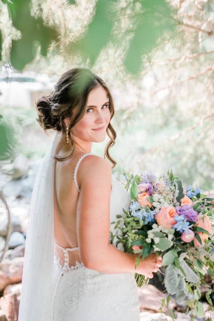 Medium Brown Loose Low Bun With Curtain Bangs — Low Bun Wedding Hair