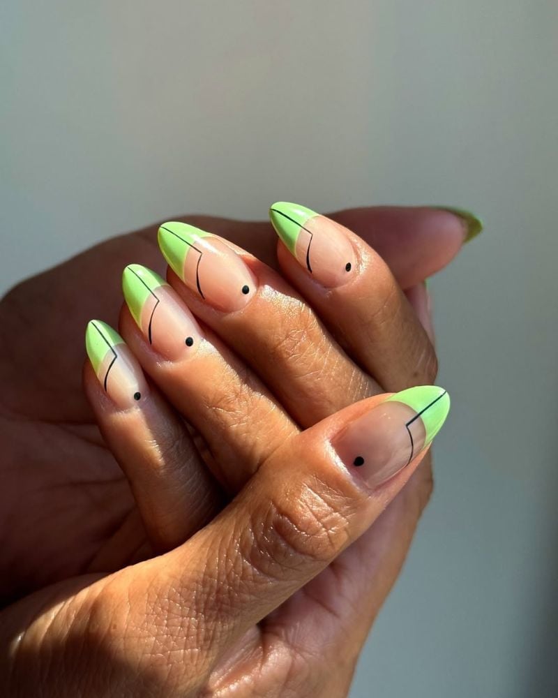 Medium Almond With Light Green Tips And Geometric Black Art — Trendy Green French Tip Nails