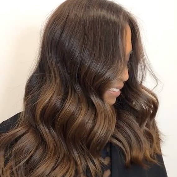 Mid-Back Chocolate With Caramel Balayage And Curtain Bangs — Trendy Chocolate Balayage